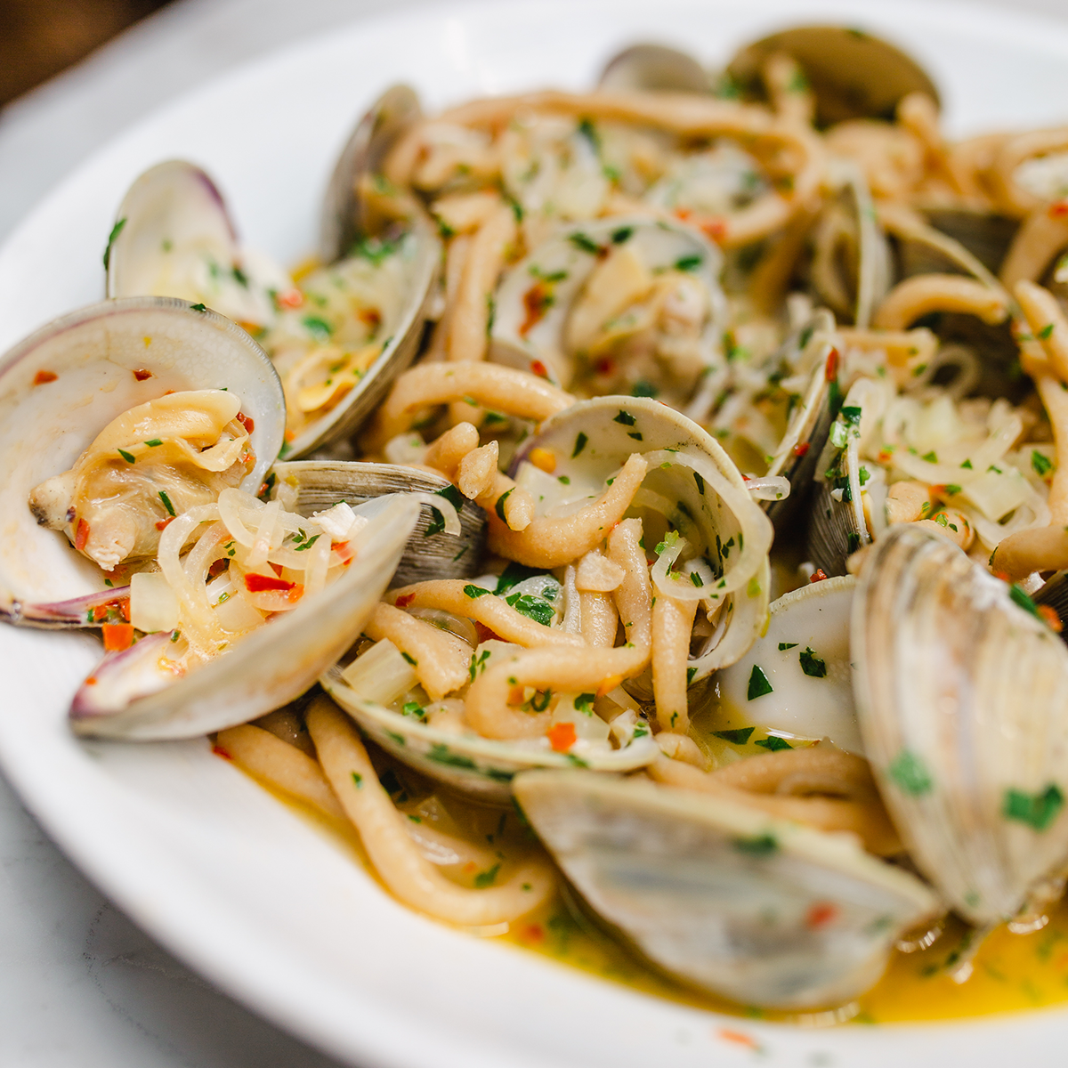 Hand Rolled Pici Pasta with Clams in White Wine Sauce